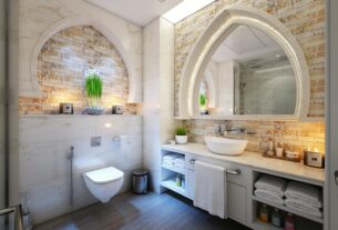 Elegant modern bathroom with marble tiles, ambient lighting, and stylish decor.